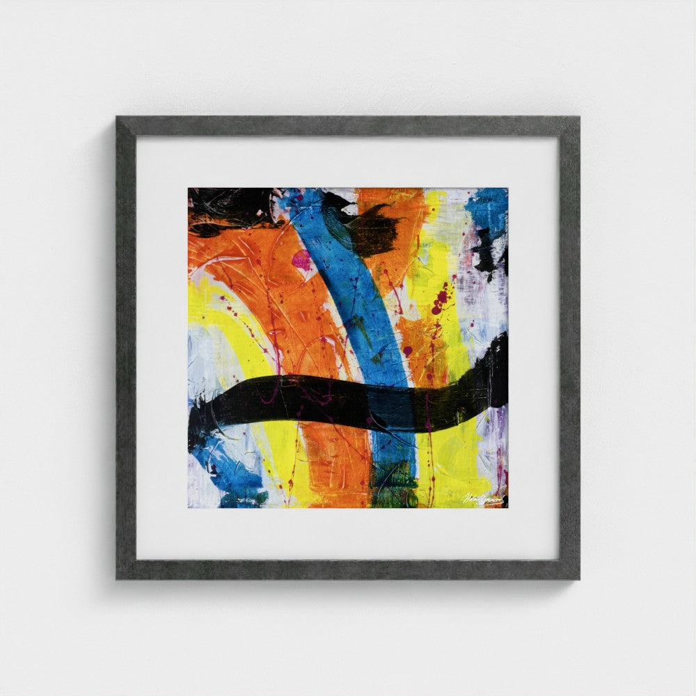 A colourful paper art print in an antique silver frame styled on a light wall
