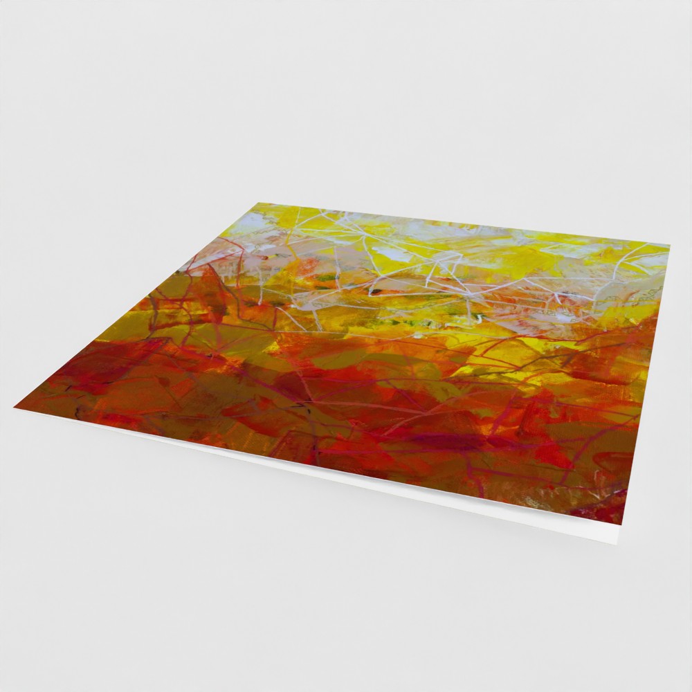 the front cover, at an angle, of a yellow square greeting card with an abstract design