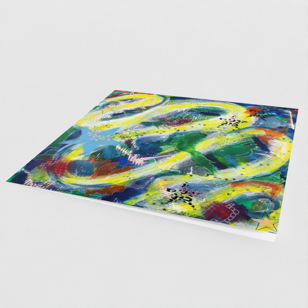 the front cover, at an angle, of a vibrant square greeting card in an abstract design