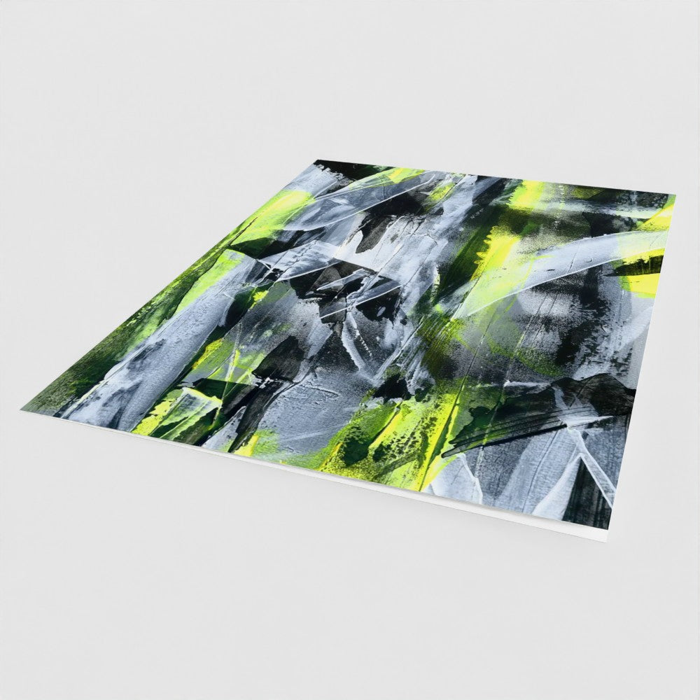 the front cover, at an angle, of a yellow portrait greeting card with an abstract design
