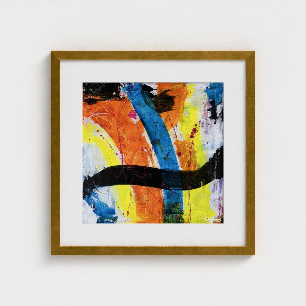 A colourful paper art print in an antique gold frame styled on a light wall