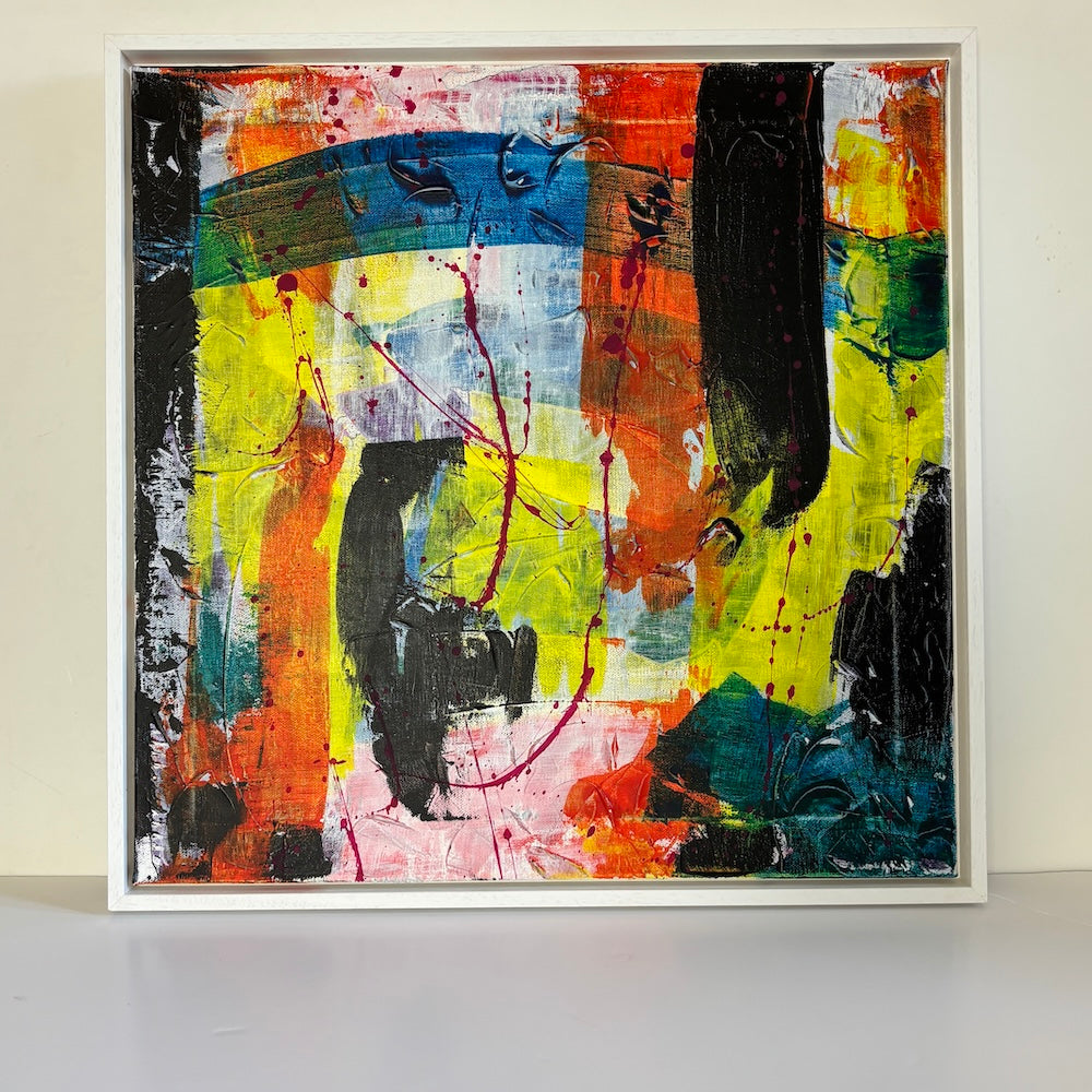multi-colour abstract original canvas painting in a white float frame with a white backdrop 