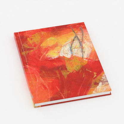 the front cover, at an angle, of a 5x7inch hardback journal with an orange abstract design