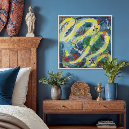 Square white framed multi-coloured abstract canvas wall art print in a cozy bohemian style bedroom with blue wall