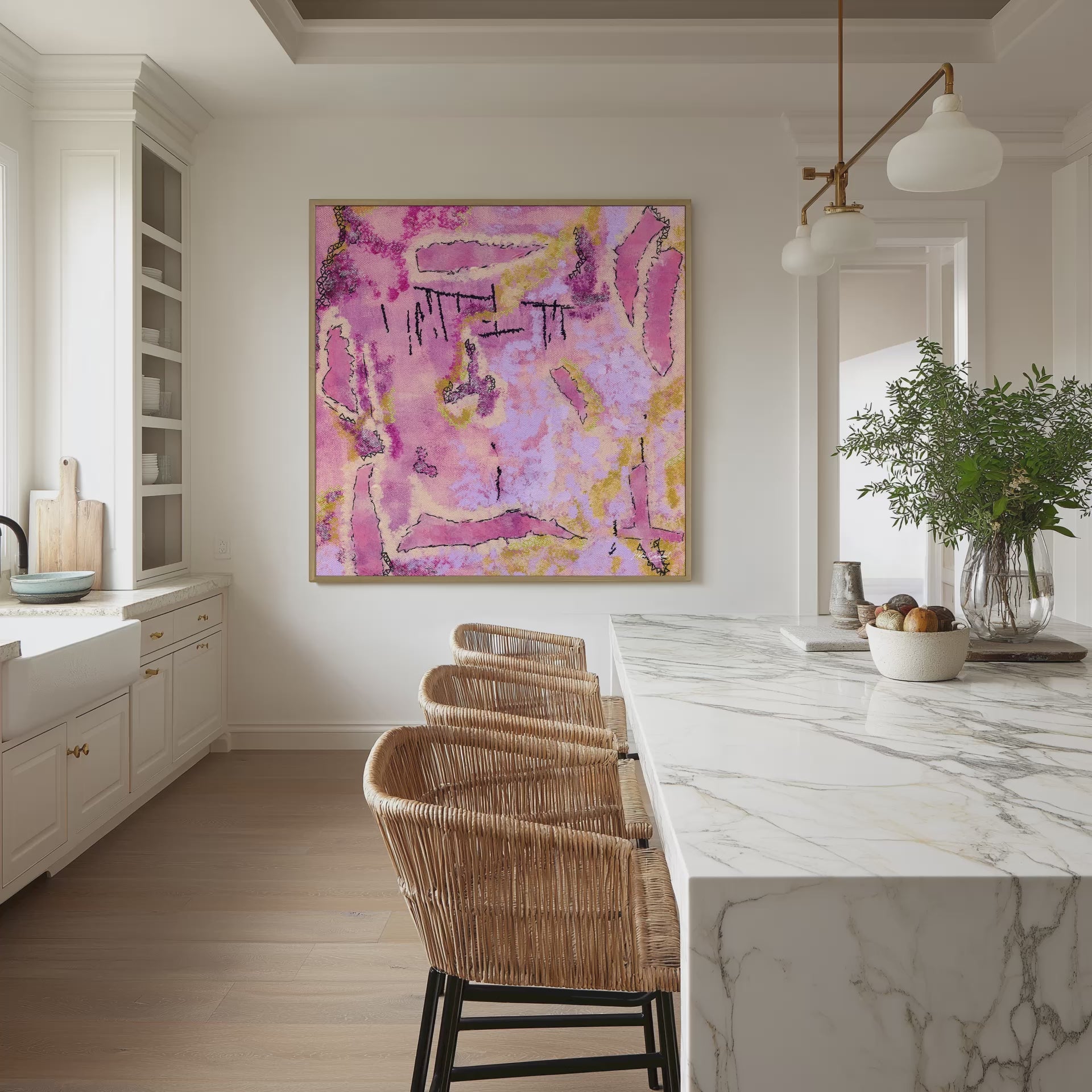 Square natural framed pink abstract canvas wall art print on a kitchen wall in front of a long table, video mockup