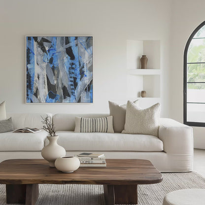 Square white framed blue abstract canvas wall art print in a living room, video mockup