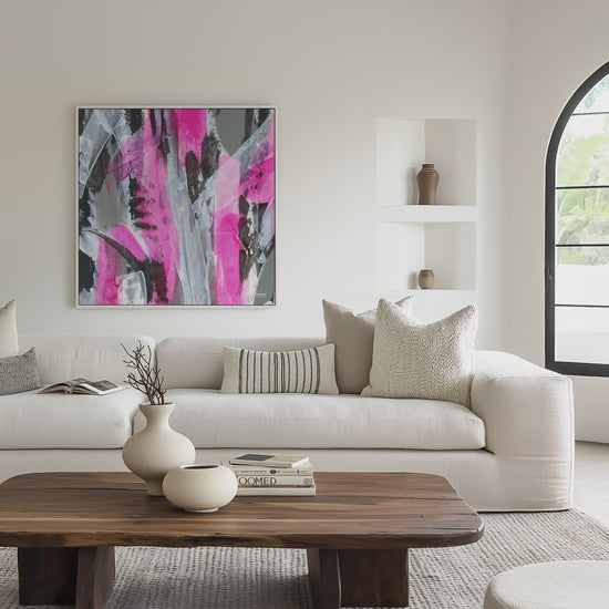 Square white framed pink abstract canvas wall art print in a light living room video mockup