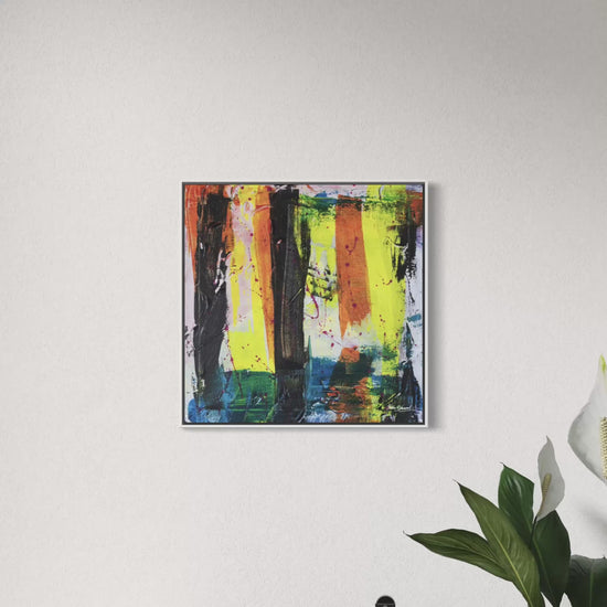 a short video of an abstract canvas original in a white frame on a light coloured wall.
