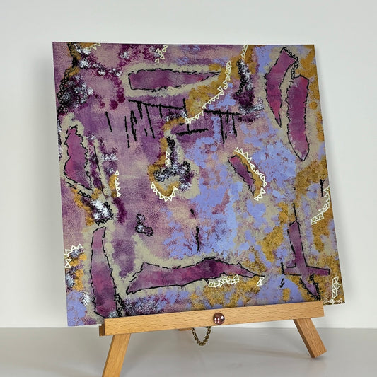 pink abstract square limited edition paper print presented on a wooden stand with a white back drop